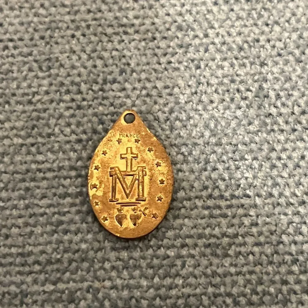 Gold-Colored Mary Charm